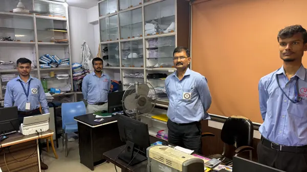 Four members of the hospital administration team in the front office.